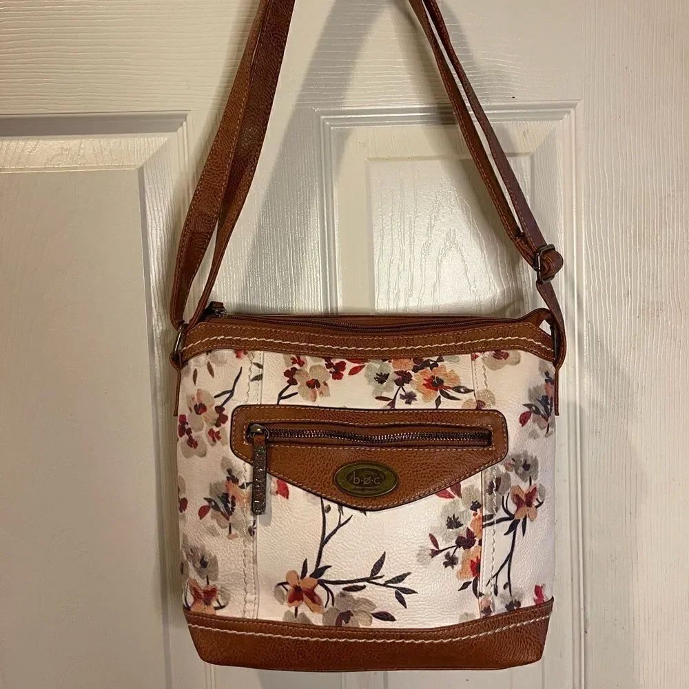 B.o.c Synthetic beige with floral prints and brown trims shoulder bag .